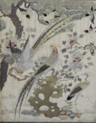 A Chinese embroidered silk panel, late 19th century, of birds amid rockwork beneath a pine tree,