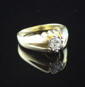 A 1990`s 18ct gold claw set solitaire diamond ring, the round brilliant cut stone approximately 0.