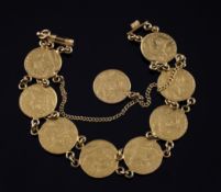 A middle eastern gold coin bracelet set with nine Persian gold coins, gross 23.8 grams.