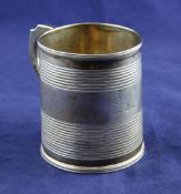 A George III silver christening mug, of tapering form, with reeded bands and engraved armorial,
