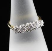 An 18ct gold and graduated five stone diamond ring, total diamond weight approximately 1.20ct,