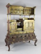 A 19th century Japanese gold lacquer cabinet on stand, the panels inlaid with ivory figures within