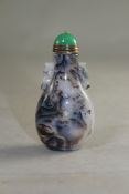 A Chinese shadow agate snuff bottle, with ribbed handles to the shoulder, 6.5cm., stopper