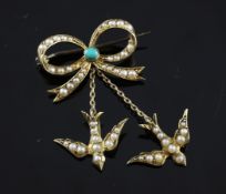 An Edwardian gold, turquoise and split pearl set ribbon and swallow brooch, the bow with two