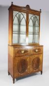 A Sheraton revival satinwood and mahogany secretaire bookcase, with a pair of glazed gothic arched