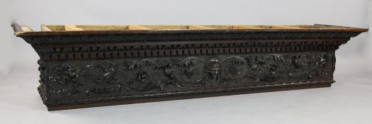 A late Victorian carved mahogany mantel or furniture section, carved in the Romanesque style with