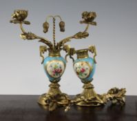 A pair of French ormolu and Sevres style porcelain mounted candelabra, late 19th century, the twin