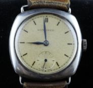 A gentleman`s 1930`s silver Longines wrist watch, with baton numerals and subsidiary seconds.