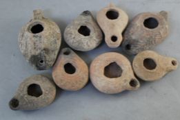 Eight Roman pottery oil lamps, 2nd-4th century A.D., of varying form and size, largest 4.5in.