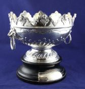 A late Victorian demi-spiral fluted silver presentation Monteith bowl, with mask scroll rim and