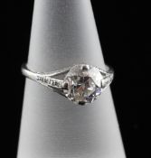 A 1940`s 18ct white gold and solitaire diamond ring, the central round brilliant cut stone