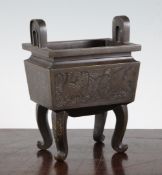 A Chinese or Japanese bronze rectangular censer, 19th century, the panelled body engraved with