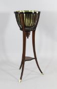 An Edwardian mahogany jardiniere stand with brass liner and slatted sides on shaped legs, H.3ft