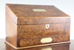 A late Victorian burr walnut writing box, the sloping hinged lid with brass plaque, fitted