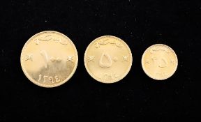 A cased set of three 1970`s Omani gold coins, 100 Baiza, 50 Baiza and 25 Baiza.