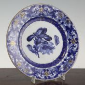 A Chinese export blue and white botanical subject plate, early 18th century, the centre painted with