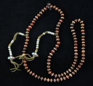 A string of Tibetan etched carnelian prayer beads, Buddhist from Afghanistan, Gandhara period, 1st-
