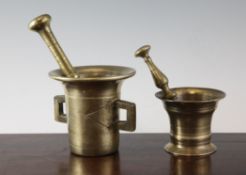 An 18th century brass pestle and mortar, with square section handles, and a small similar pestle and