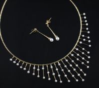 A modern 9ct gold and cultured pearl set fringe necklace and matching earrings.
