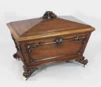 A Victorian mahogany sarcophagus shaped wine cooler, with applied scroll decoration. W.2ft 11in.