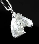 An 18ct white gold and horse head shaped diamond pendant, the stone weighing approximately 2.18ct,