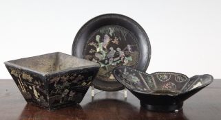 Four items of Chinese lac burgaute ware, Kangxi period, comprising a pair of circular dishes