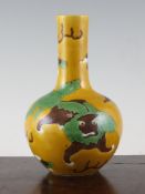 A Chinese Sancai glazed bottle vase, 18th / 19th century, incised and decorated with a Buddhist lion