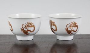 A pair of Chinese `dragon medallion` cups, Kangxi mark but later, each decorated in gilt and