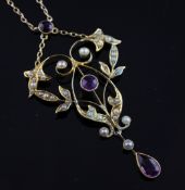 An Edwardian 15ct gold amethyst and split pearl set drop pendant necklace, of scrolling foliate