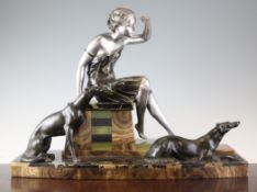 Uriano. A bronzed spelter, onyx and marble Art Deco group of a woman and two Borzoi, 17in.