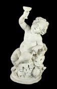 A 19th century carved marble figure of a Bacchanalian cherub, holding a goblet, in the manner of