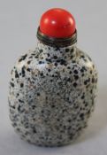 A Chinese dalmation jasper snuff bottle, 6cm., stopper
