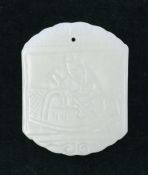 A Chinese pale celadon jade plaque, carved in bas-relief with a figure on a boat and with