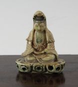 A Chinese soapstone seated figure of Guanyin, 17th/18th century, with some polychrome decoration, on