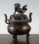 A Chinese bronze censer, with associated cover, 18th / 19th century, the censer cast in relief