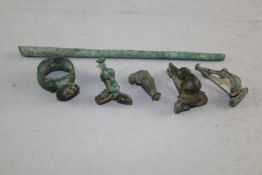 Four Roman bronze fibula brooches, a similar seal top ring and a tool, 1st-2nd century A.D.