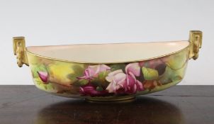 A Royal Worcester porcelain boat shaped bowl, painted by R.H. Austin, with pink rose bouquets with