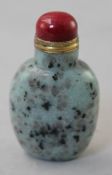 A Chinese Kiwi stone snuff bottle, 6.3cm., stopper