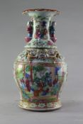 A Chinese Canton decorated vase, mid 19th century, typically painted with figures amid pavilions,