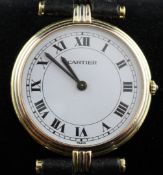 An 18ct gold Cartier quartz wrist watch, with Roman dial and fluted bezel and lugs.
