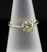 An 18ct gold solitaire diamond ring, the round brilliant cut stone approximately 0.70ct, size M.