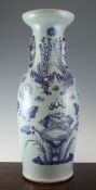 A Chinese celadon glazed vase, early 20th century, painted in underglaze blue with two phoenixes,
