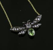 A Victorian style gold, peridot, ruby and diamond set bug pendant necklace, on an 18ct gold fine