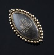 An early 19th century gold memorial brooch pendant, with beaded borders and initials MJH, 2in,
