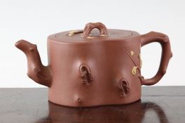 A Chinese Yixing pottery teapot, in the form of a prunus bough, with crabstock handle and spout, and