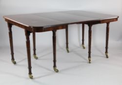 An Regency mahogany extending dining table, on ring turned supports, two extra leaves, 8ft 1in.