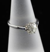 A 1940`s 18ct white gold set solitaire diamond ring, the cushion cut stone approximately 0.75ct,