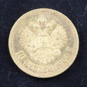 A cased Russian 1900 ten ruble gold coin.
