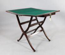 A Victorian mahogany coaching / card table, with single frieze counter drawer and `x` frame base,