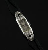 A lady`s 1930`s 18ct white gold and diamond set cocktail watch, with rectangular Arabic dial, on